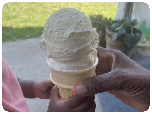 mom and daughter sharing ice cream